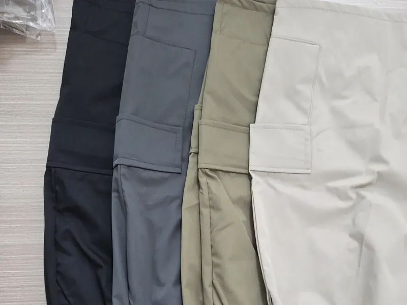 Four colorways of the same trouser style laid side by side